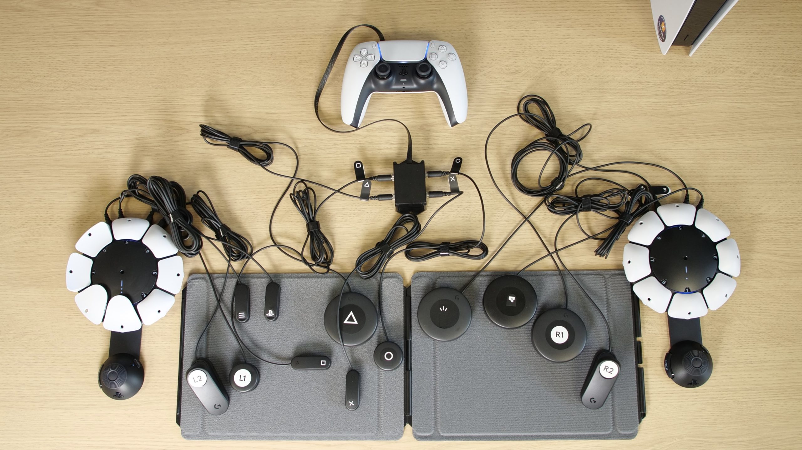 The controller is shown alongside two Access controllers and twelve Logitech G switches.