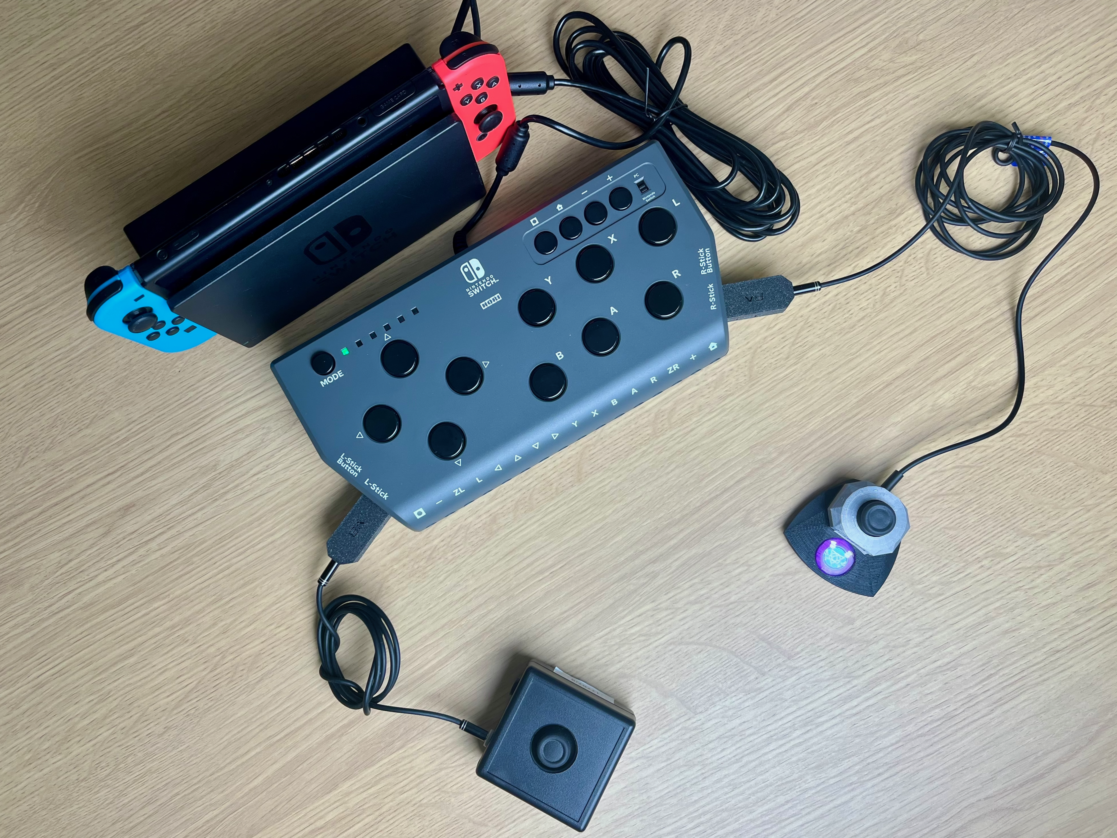 Photo showing the Hori Flex connected to a Nintendo Switch and two HID Remapper v8 devices connected to the Hori flex Left and Right Stick pUSB ports. Into each of those is a joystick with a 3.5mm connection.