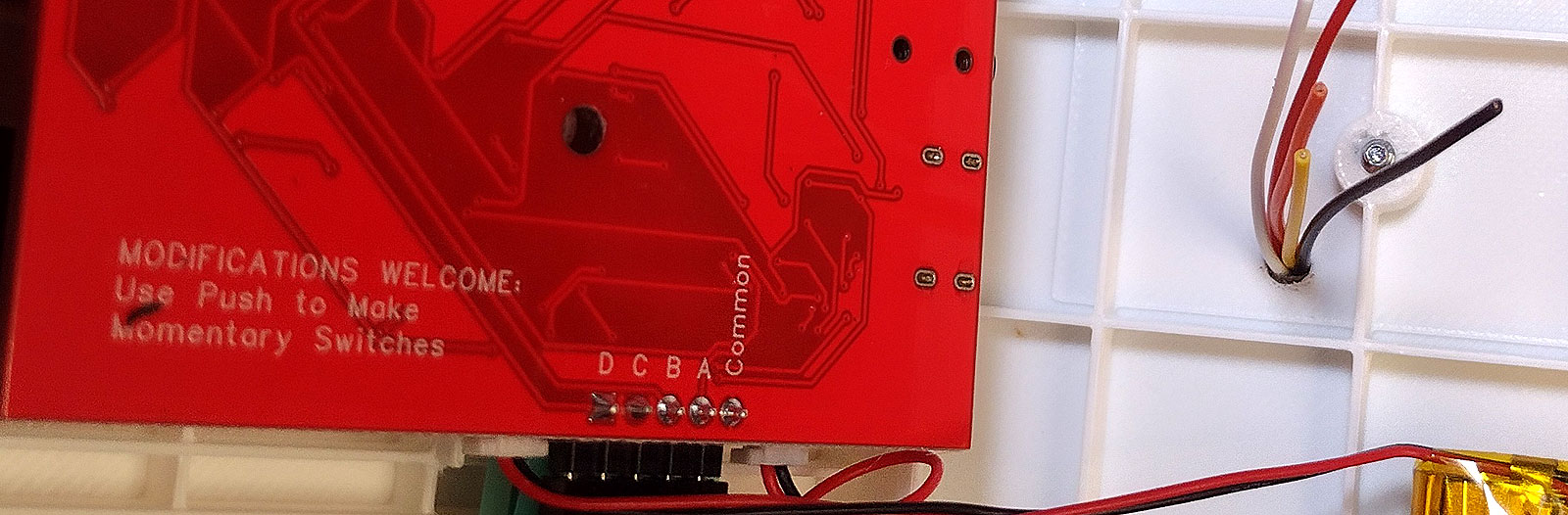 PCB reads: Modifications Welcome: Use Push to Make Momentary Switches. Five solder contacts read, D,C,B,A and Common.