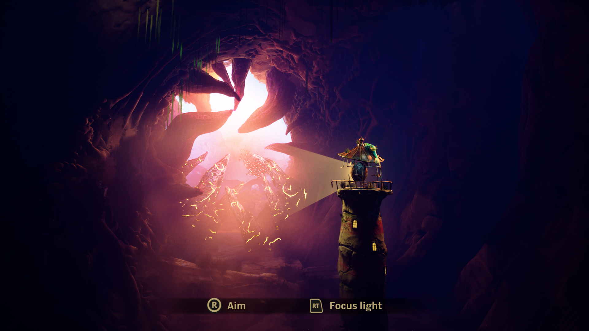 Screenshot showing a lighthouse with its beam shining on rocks covering an opening. the onscreen control prompts show Right Stick for Aim and RT to Focus Light.