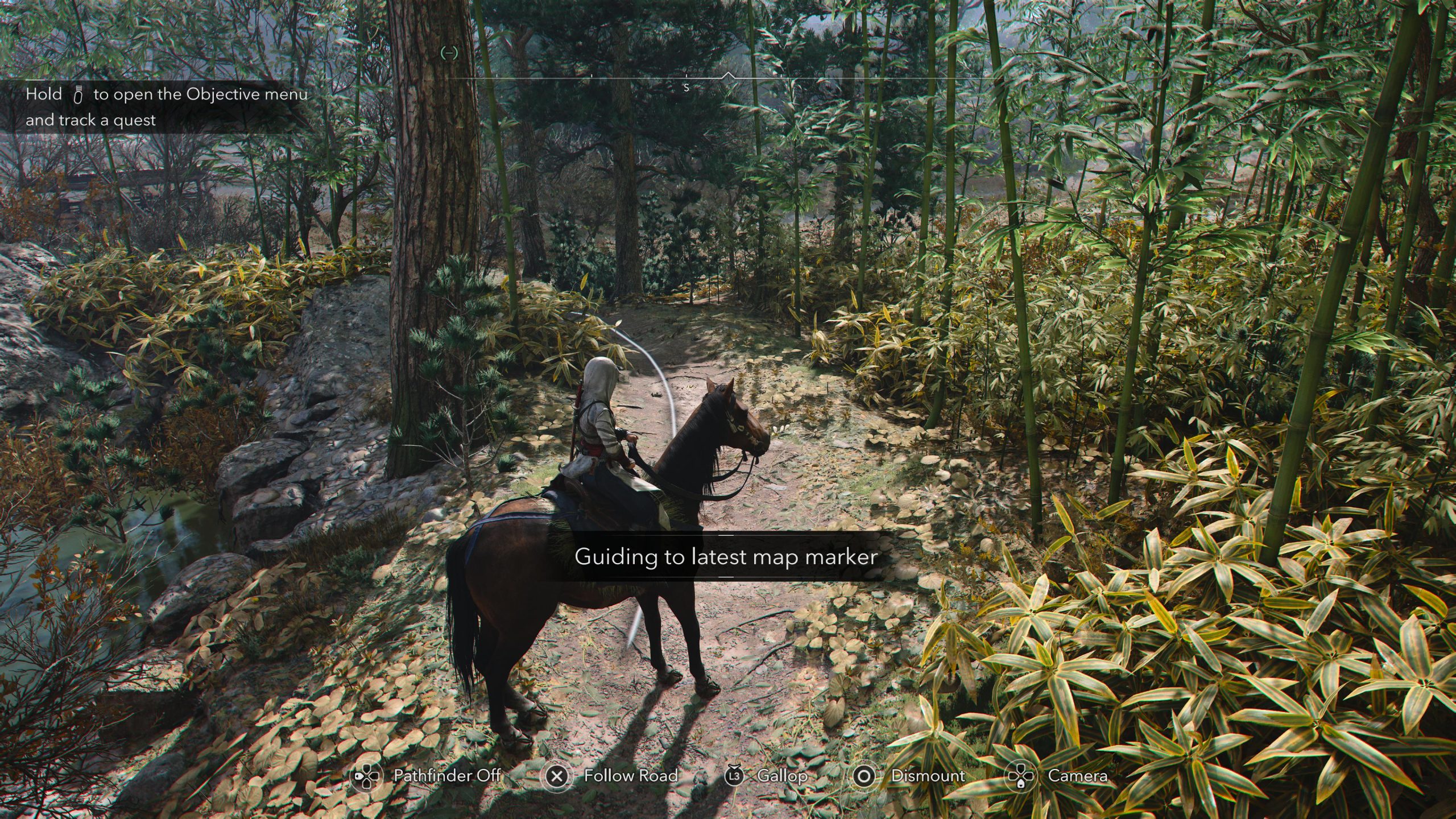 Screenshot showing a character on a horse standing on a forest path with a prompt stating 'Guiding to the latest map marker'.